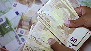 Detail of woman hands with euro money
