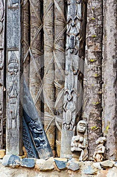 Detail of wood carving of animals on pillars at traditional Fon`s palace in Bafut, Cameroon, Africa