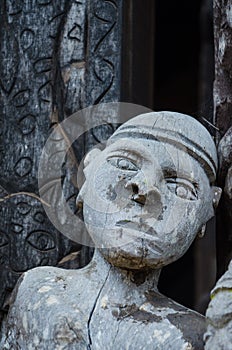 Detail of wood carving of male human at traditional Fon`s palace in Bafut, Cameroon, Africa