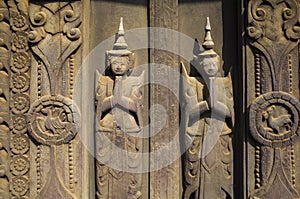 Detail of woodcarvings at the Shwe In Bin teak monastery in Mandalay, Myanmar photo