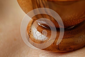 detail of wooden cup on skin creating suction