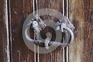 Detail of wrought iron decoration on an old wooden door in a castle