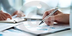 The detailed analysis of financial reports with a pen and documents. AI generated image