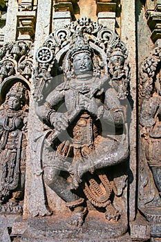 Detailed carvings of deity with ornaments at Somnathpur, Karnataka. photo