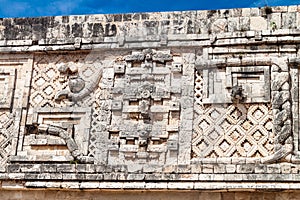 Detailed carvings at the Nun`s Quadrangle Cuadrangulo de las Monjas building complex at the ruins of the ancient Mayan photo