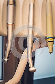 Detailed close up of different dental instruments and tools