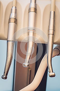 Detailed close up of different dental instruments and tools