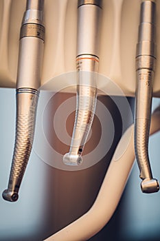 Detailed close up of different dental instruments and tools