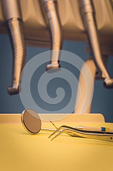 Detailed close up of different dental instruments and tools on a