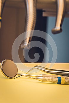 Detailed close up of different dental instruments and tools on a