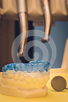 Detailed close up of different dental instruments and tools on a