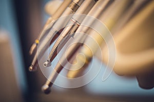 Detailed close up of different dental instruments and tools