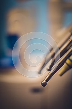 Detailed close up of different dental instruments and tools