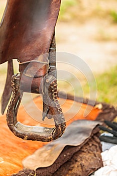 Detailed close up of horse saddle with stirrup