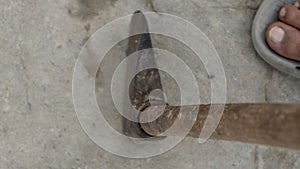 Rustic gardening hoe on concrete