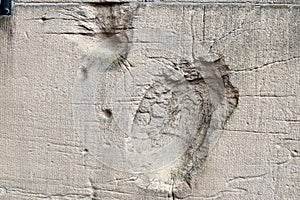 Detailed close up of a structured concrete wall with some cracks