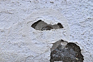 Detailed close up view on weathered concrete and cement cracked wall textures