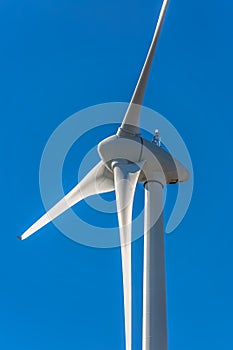 Detailed close up view of a wind turbines; generator, rotor and blade view