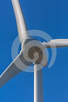 Detailed close up view of a wind turbines; generator, rotor and blade view