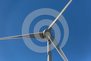 Detailed close up view of a wind turbines; generator, rotor and blade view