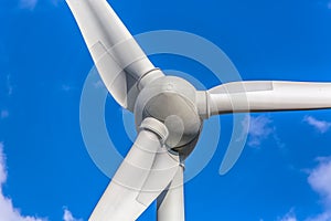 Detailed close up view of a wind turbines; generator, rotor and blade view