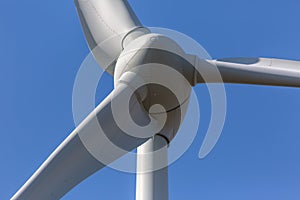 Detailed close up view of a wind turbines; generator, rotor and blade view