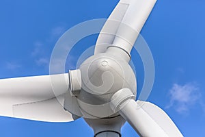 Detailed close up view of a wind turbines; generator, rotor and blade view