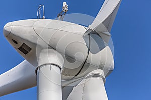 Detailed close up view of a wind turbines; generator, rotor and blade view