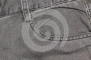 Detailed closeup of blank grungy denim. Vintage gray jeans with laces, good for background