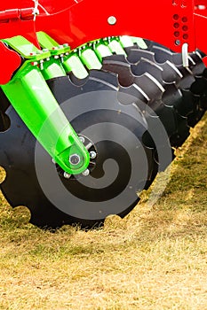 Detailed closeup of disc harrow agricultural machinery