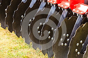 Detailed closeup of disc harrow agricultural machinery