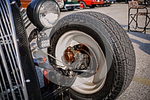 detailed closeup view of old classic vintage car wheel and other brake components