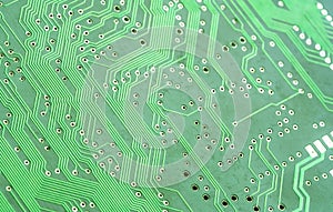 Detailed complex green PCB circuit board abstract background texture, backdrop, wallpaper, shallow depth of field, copy space.