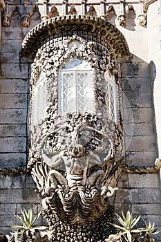 Detailed design and sculpture of a Newt above the entrance to the Pena National Palace of Sintra