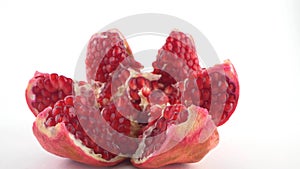 detailed disclosed pomegranate with ripe seeds isolated white background