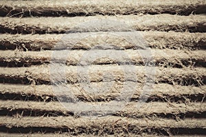 Detailed fragment of dirty air filter surface.