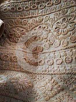 A detailed image of an Indian embroidery. Aesthetic floral embroidery over an etnic costume, kurta.