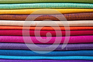 detailed image of multicolored espadrille fabrics stacked up
