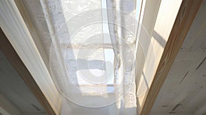 A detailed image of a skylight covered in a gauzy fabric allowing natural light to filter through while still providing