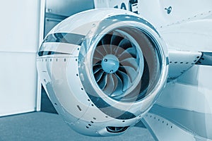 Detailed insigh tturbine blades of an aircraft jet engine, colored technical blue, business jet engine close up high detailed view