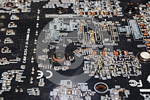 Detailed Macro Image of an Electronic Circuit Board Showing Microchips, Resistors, and Components