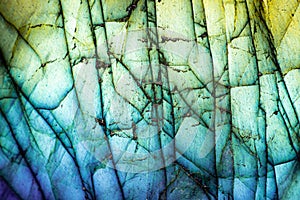 Detailed Macro Photo of a Colorful Blue Labradorite Stone with Cracked Textures.