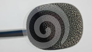 Close-up of a microphone windscreen