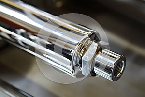 detailed photo of a chromeplated rod of a hydraulic cylinder