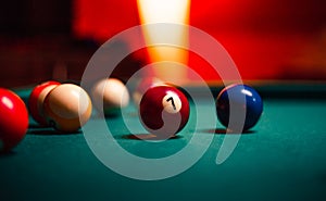 Detailed photo of pool billiard balls on cozy warm backround with orange lighting. Close up image of colorful billiard balls