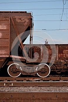 Detailed photo of railway freight car. A fragment of the component parts of the freight car on the railroad in dayligh