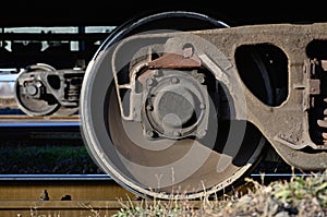 Detailed photo of railway freight car. A fragment of the component parts of the freight car on the railroad in dayligh