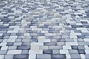 A detailed photo of the square, laid out of modern paving stone with rounded corners. Accurate design of pedestrian area