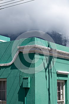 Detailed photo of turquoise house in the Malay Quarter, Bo Kaap, Cape Town, South Africa.