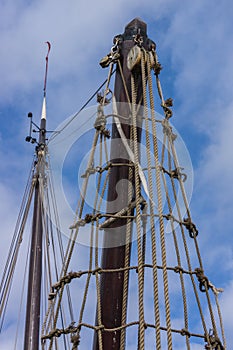 Detailed shot of antique rigging of an old wooded sailing ship in Holland